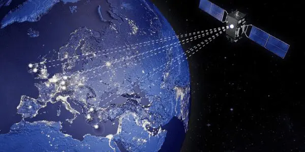 A satellite orbits the Earth at night, with illuminated cities across Europe and Asia connected by lines.
