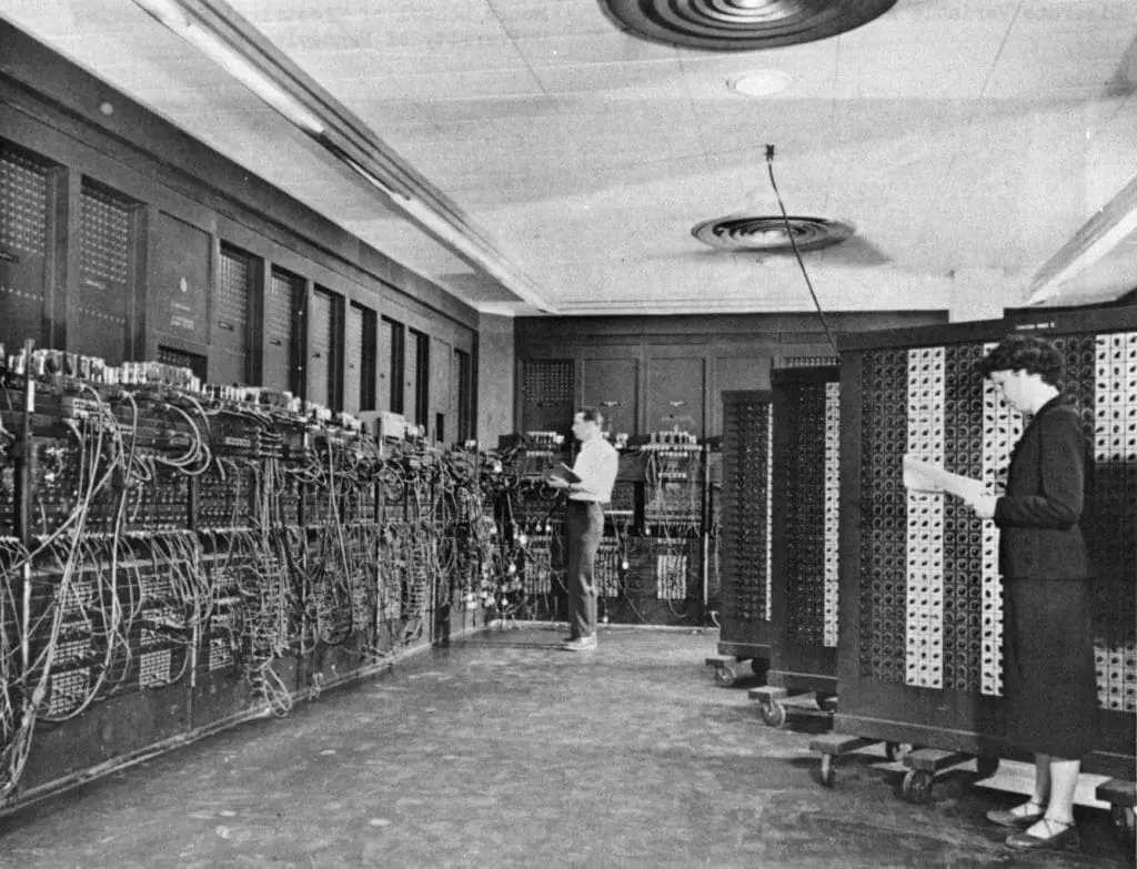 ENIAC (Electronic Numerical Integrator And Computer) in Philadelphia, Pennsylvania. Glen Beck (background) and Betty Snyder (foreground) program the ENIAC in building 328 at the Ballistic Research Laboratory (BRL). US Army Photo.