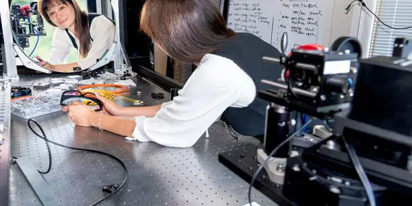 ustine Haupt looks in a mirror in the Quantum Lighthouse