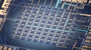 A complex circuit board with numerous interconnected components is displayed against a dark blue background, illuminated with glowing teal lines.