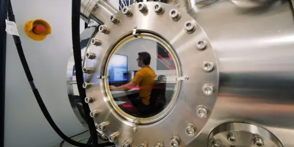 Researcher mirrored in P-Name that can implant individual atoms into a material with a precision of 20 nanometres