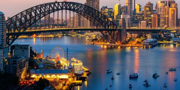 Sydney Harbour at sunset with a graphic #1 and text