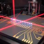 A chain of trapped ions lit by red lasers
