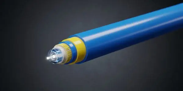 A blue optical fiber cable tip glowing with a beam of transmitted light on a dark background.