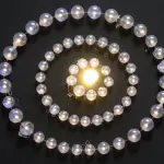 A spiral of glowing, translucent spheres encircles a bright central light source on a dark, textured surface.