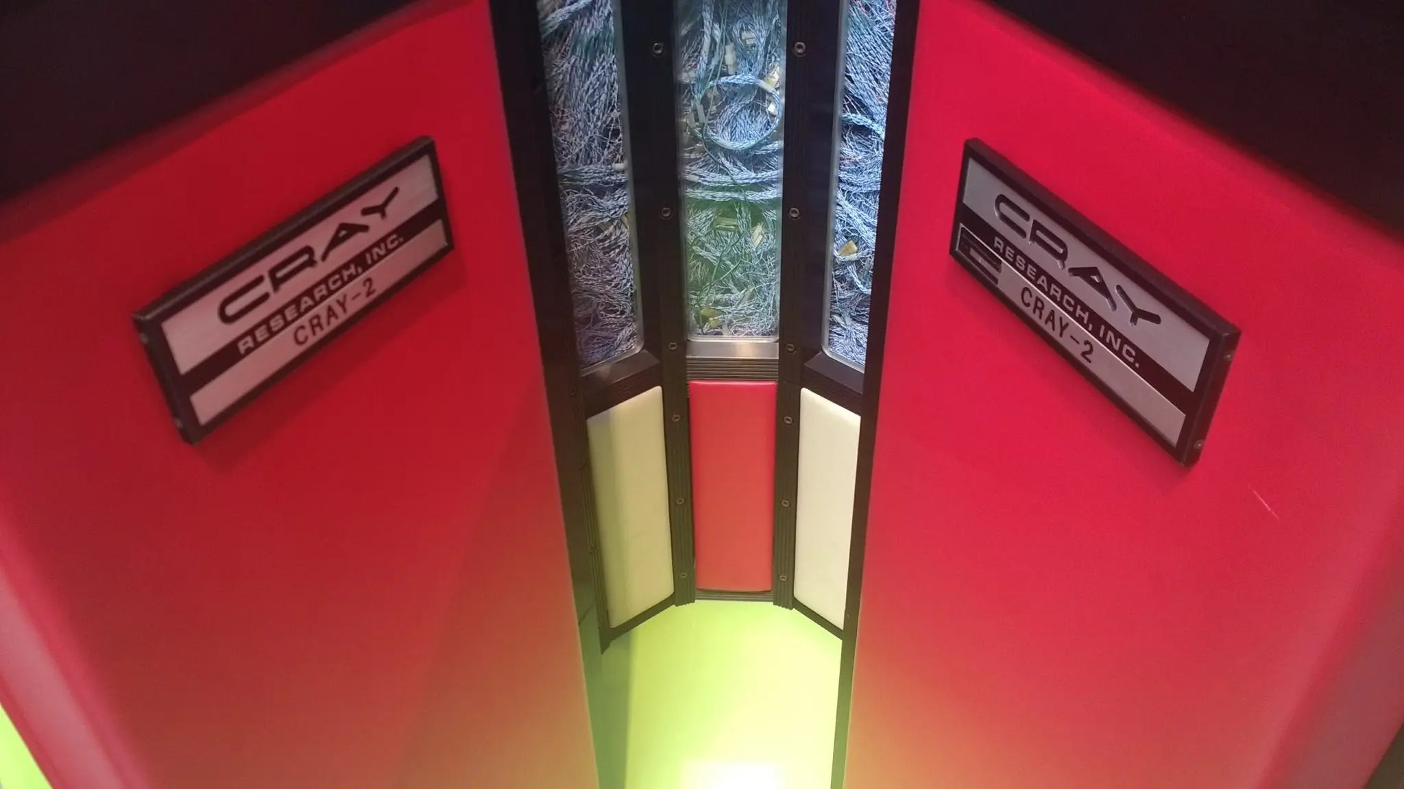 Cray Research nameplates on a Cray-2, with the machine's internal wiring visible between the panels