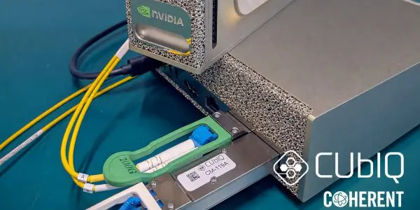 CUbIQ CM-119A CV-QKD pluggable seated in the QSFP port of an NVIDIA DGX Spark host with fibre patch cords attached