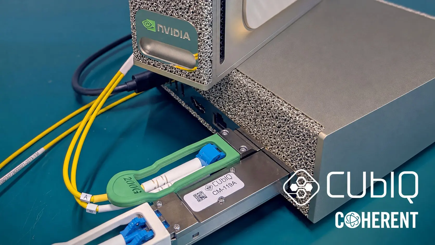CUbIQ CM-119A CV-QKD pluggable seated in the QSFP port of an NVIDIA DGX Spark host with fibre patch cords attached