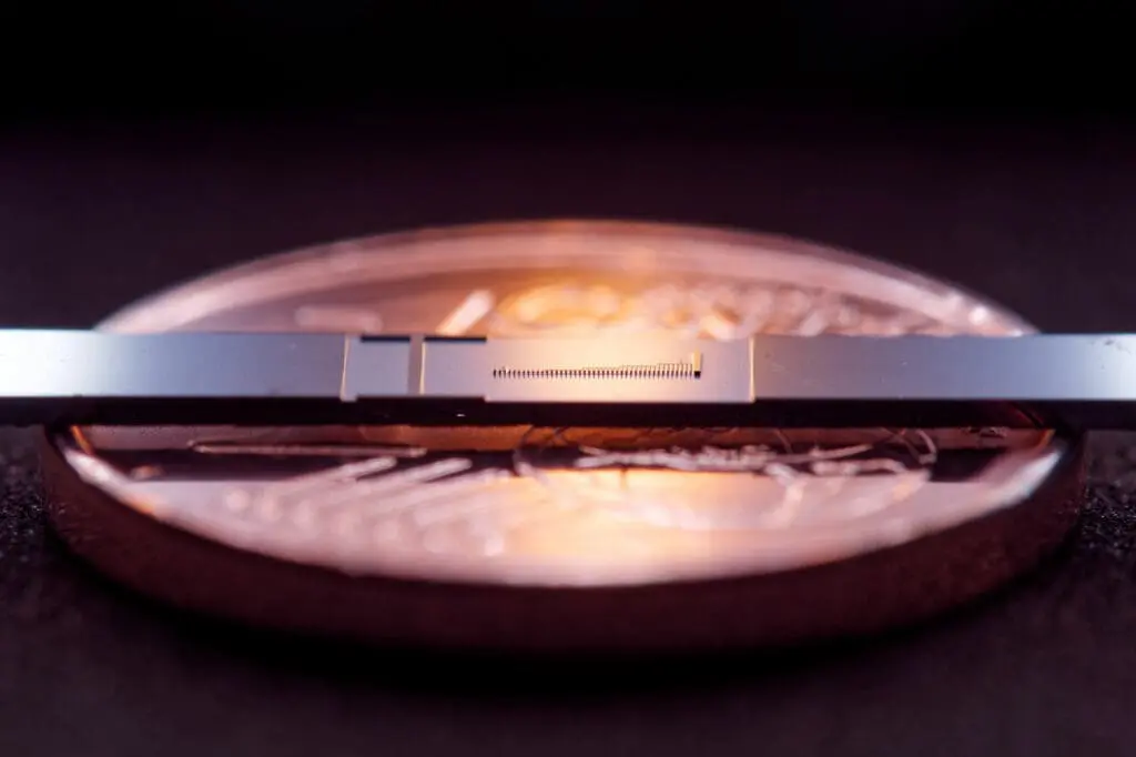 Scientists create tiny particle accelerator on a chip.