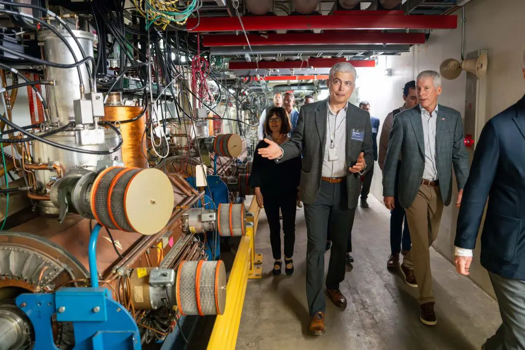 Head of Fermilab Accelerator Directorate Alexander Valishev (center) shows Secretary of Energy Chris Wright (right) part of the Main Injector, which produces the world’s most powerful high-energy neutrino beam, on July 17, 2025.