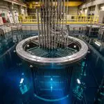 An open nuclear reactor pool glowing blue