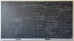 A blackboard of quantum circuit diagrams and matrix algebra