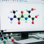 A computational chemistry workstation with a molecular model