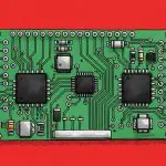 Green circuit board with labelled chips