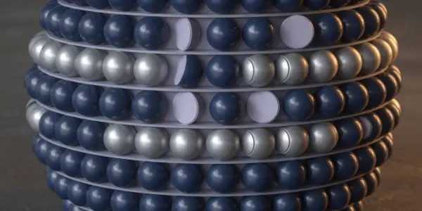 A tightly-packed arrangement of dark blue and silver spheres is presented on a dark surface, lit dramatically.