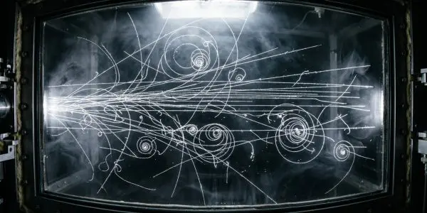 Particle tracks threading a cloud chamber