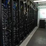 A row of server racks inside the Lincoln Laboratory Supercomputing Center