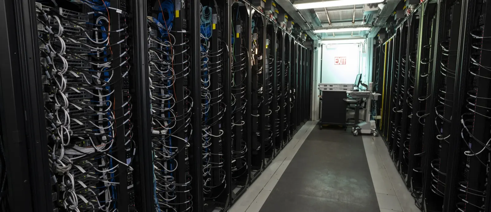 A row of server racks inside the Lincoln Laboratory Supercomputing Center