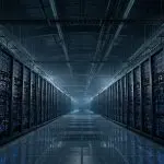 A long aisle of humming compute racks