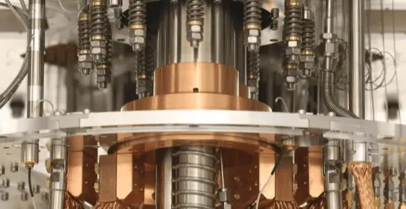 This close-up shows a complex, high-precision scientific instrument within a laboratory setting, featuring metallic components.
