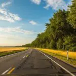 Open country road under blue sky