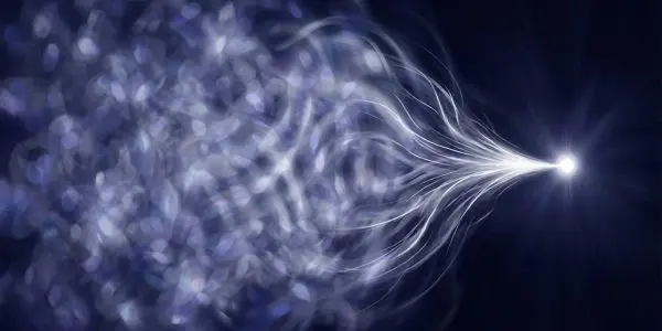 A diffuse wave gathering into a single bright point, the collapse that QBism reinterprets as one agent updating their expectations