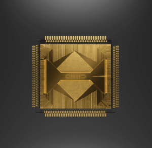 A highly detailed golden computer chip is prominently displayed against a dark grey background, showcasing intricate geometric patterns.