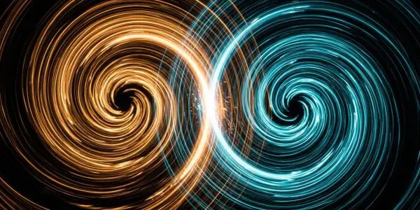 An orange and a cyan spiral interlocking