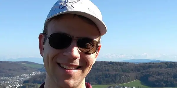 Close up photo of Dr Yannick Ulrich with a cap on