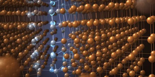 Two misoriented crystal grains meeting along a strained boundary