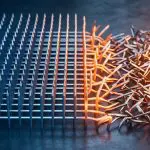 An ordered spin lattice collapsing into a heap at a heat front