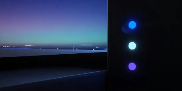A dark room contains a large screen displaying a twilight seascape, alongside a column of glowing blue lights.