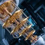 Gold cryostat stages with copper wiring spanning between frosted flanges, tilted in a lab