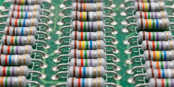 Rows of colour-banded resistors mounted on a green circuit board