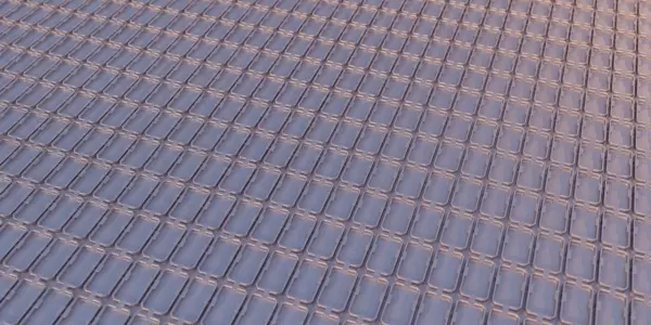 A grid of rectangular structures, possibly a quantum processor, is illuminated with a pink and purple gradient.