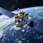 A dish-laden satellite above the curve of the Earth