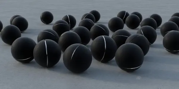 A scattering of dark spheres with light bands rest on a textured grey surface, illuminated by soft lighting.
