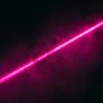 A vibrant pink light streak cuts across a dark, speckled background, creating a dynamic and energetic visual effect.