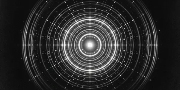 A black background features concentric circles of bright white and grey light, creating a hypnotic, tunnel-like effect