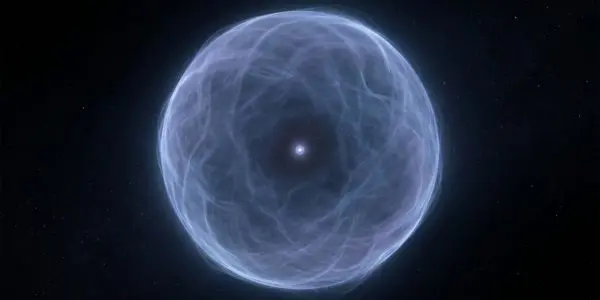 A vast diffuse electron cloud around a tiny bright nucleus