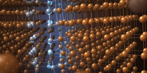 Two misoriented crystal grains meeting along a strained boundary
