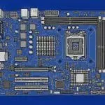 A blue-toned top-down 3D render of a bare computer motherboard with CPU socket and slots.