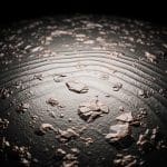 Lithium’s Work Function Alters with Isotope and Temperature