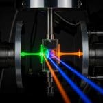 Kerr-Enhanced Three-Wave Mixing Achieves Gain Beyond Subthreshold Amplifiers