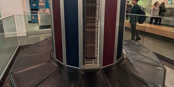 A Cray-1 supercomputer at the Science Museum in London, showing the C-shaped cabinet and the padded bench around its base