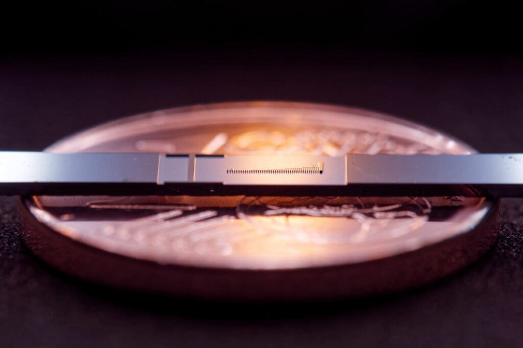 Scientists create tiny particle accelerator on a chip.