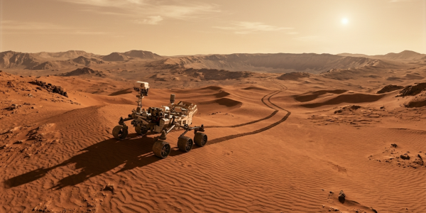 A rover tracking across Martian dunes