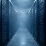 An aisle between two walls of dense server racks