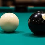The Billiard Ball Computer: A Mechanical Model of Reversible Computation
