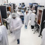 PsiQuantum personnel inside the fiber attach assembly facility at PsiFactory in Milpitas, California. PsiQuantum’s